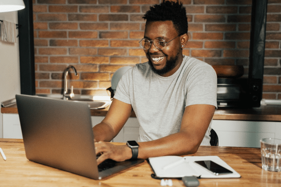 Man_doing_accounting_on_a_laptop